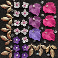 Load image into Gallery viewer, Mix #1 of acrylic leaves, flowers, beads, and gold alloy leaves 28 pieces
