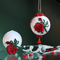Load image into Gallery viewer, Decorative ornament with red roses on a dark background. (White)
