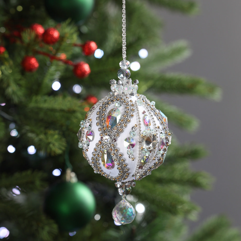 Decorative Christmas ornament hanging on a tree with blurred background