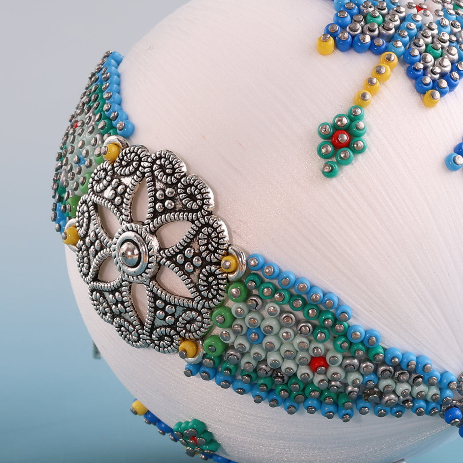 Hundreds of beads applied to satin ball with pins with a silver charm connector. (White)