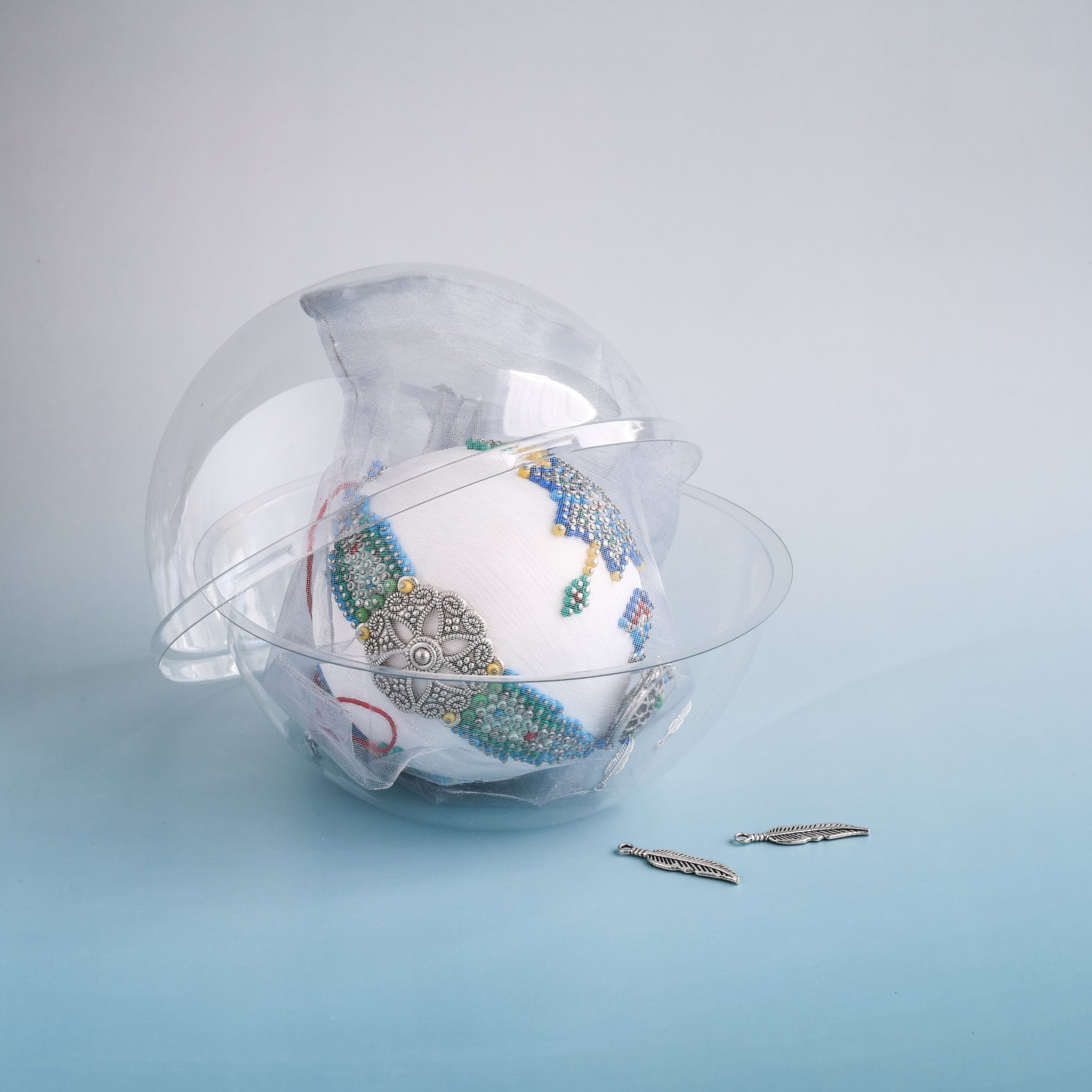 Indian Summer, white satin beaded ornament, wrapped in tulle and packed in a clear round container. (White)