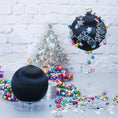 Load image into Gallery viewer, Jingle Bells Satin Ornament -Black DIY Christmas push pin kit, featuring large glass beads, sparkling silver trim, sequins, and alloy snowflakes, set against a white brick backdrop.
