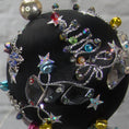Load image into Gallery viewer, Close-up of a different side satin beaded ornament Jingle Bells, handmade black Christmas push pin decoration, featuring large glass beads, sparkling silver trim, sequins, and alloy snowflakes.
