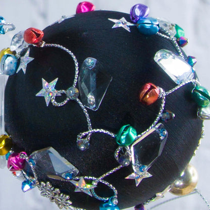 Close-up of a different side satin beaded ornament Jingle Bells, handmade black Christmas push pin decoration, featuring large glass beads, sparkling silver trim, sequins, and alloy snowflakes.