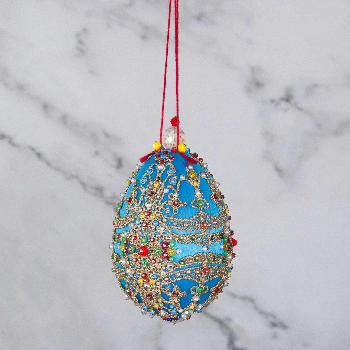 This Faberge Inspired Push Pin Easter  Ornament is one-of-a-kind from Whim5seasons. It showcases striking blue and colors with gold accents. (Sky Blue)