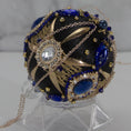 Load image into Gallery viewer, Close-up of Phoenix Christmas Beaded Handmade Push Pin Ornament embellished with gold cameos, intense blue rhinestones, metal accents, and rose old chain. (Black)
