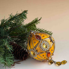 Beautiful Christmas ornament with a green branch with a beige background. (Light Yellow)