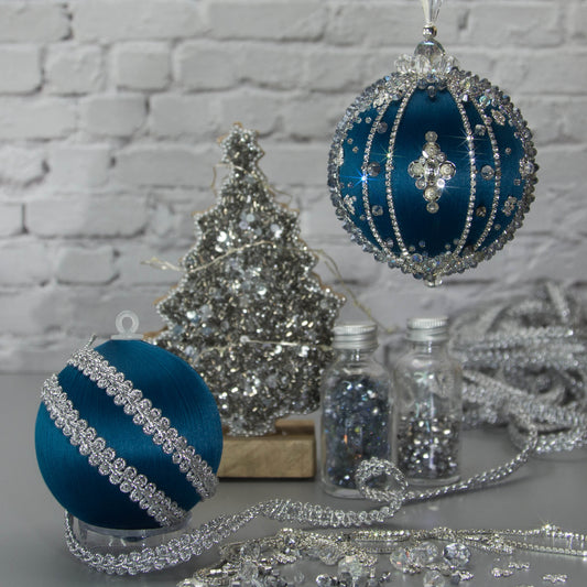 Polar Night Satin Ornament -Elegant DIY Christmas push pin kit, featuring blue satin ball, sparkling silver beads, sequins, and rhinestone accents, perfect for holiday crafting, set against a white brick backdrop.