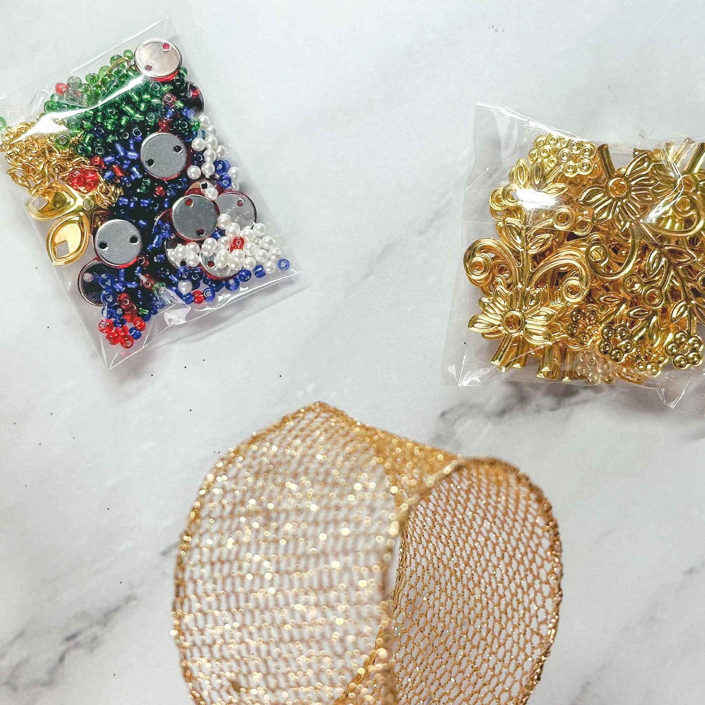 Quam Beaded Ornament Kit - Materials needed to complete the Beginner-Friendly project: beads, metal stampings, multicolor rhinestones. (Green)