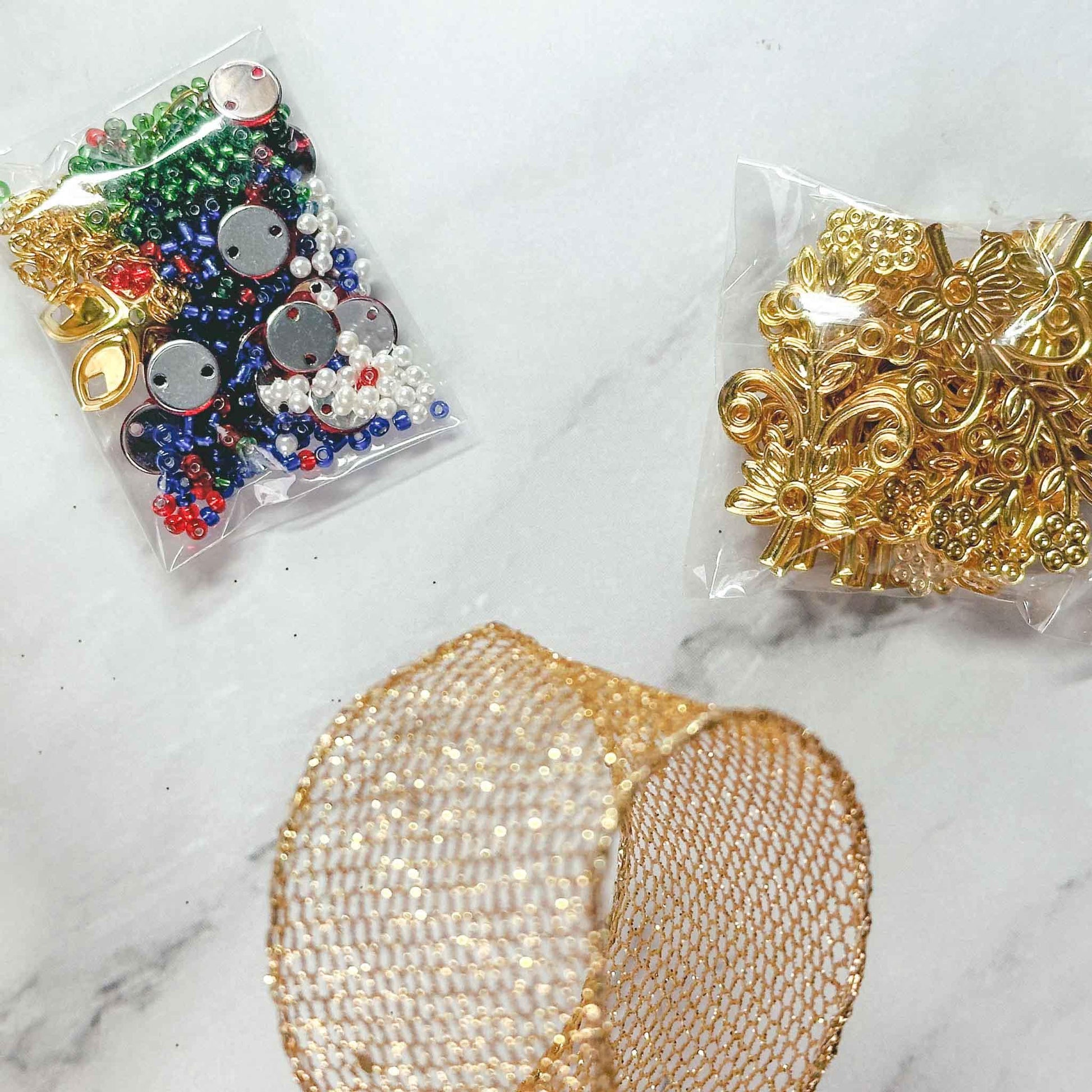 Quam Beaded Ornament Kit - Materials needed to complete the Beginner-Friendly project: beads, metal stampings, multicolor rhinestones. (Green)