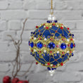 Load image into Gallery viewer, Scheherazade Handmade Satin Ornament -Festive blue ball with indigo rhinestones, sparkling gold trim, sequins, red bicone beads, and metallic cord.  (Dark Slate Blue)
