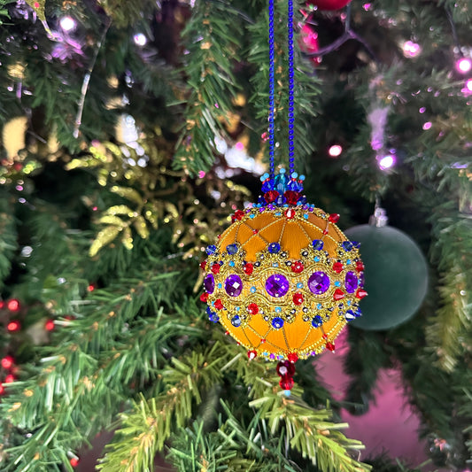 Handmade, beautifully crafted by Whim5seasons, satin ornament Scheherazade with purple rhinestones and gold accents hanging on Christmas Tree. (Gold)