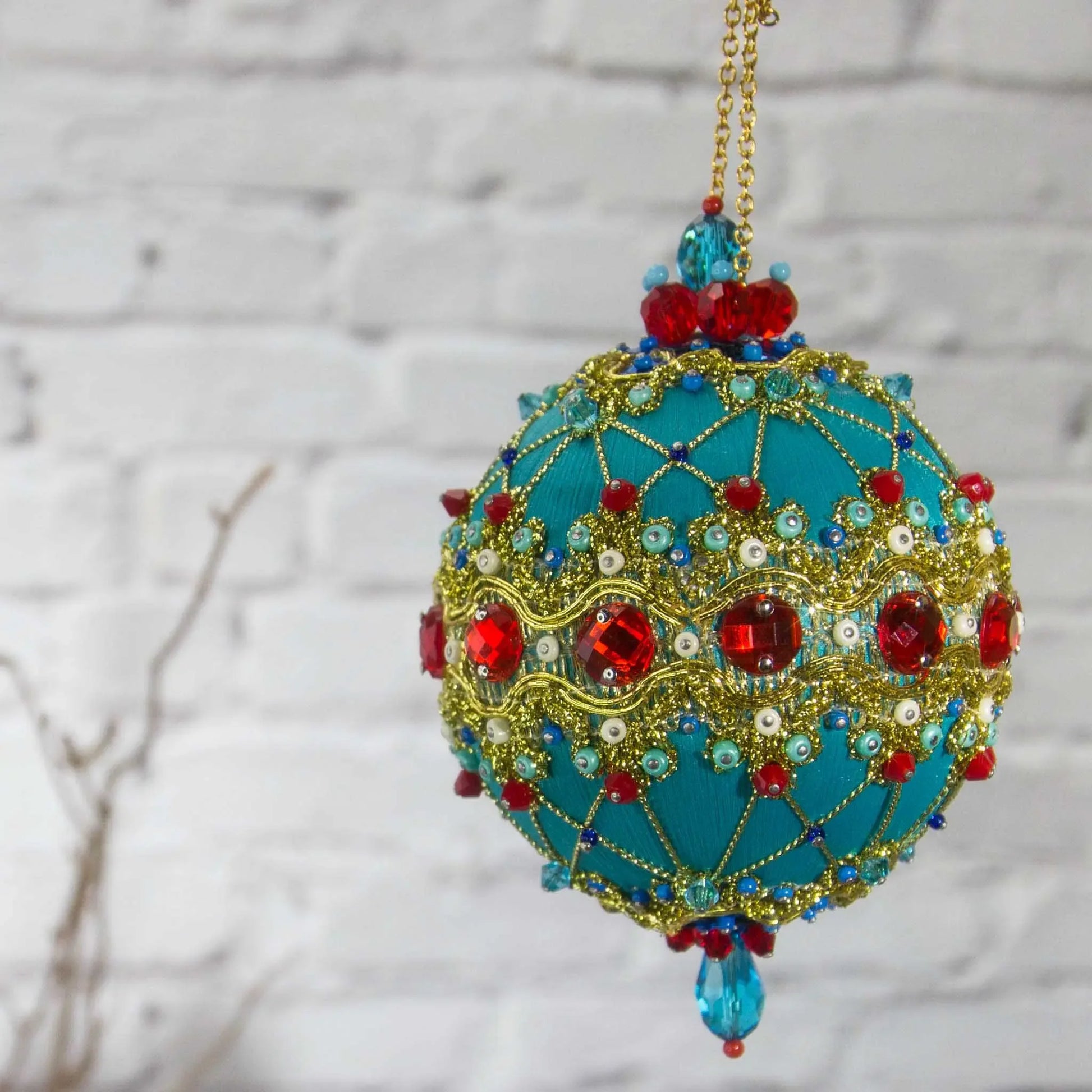 Scheherazade  Handmade Satin Ornament - Teal colored Christmas push pin decoration, featuring red rhinestones, red bicone beads, sequins, and metallic cord, perfect for holiday crafting, front view. (Light Sea Green)