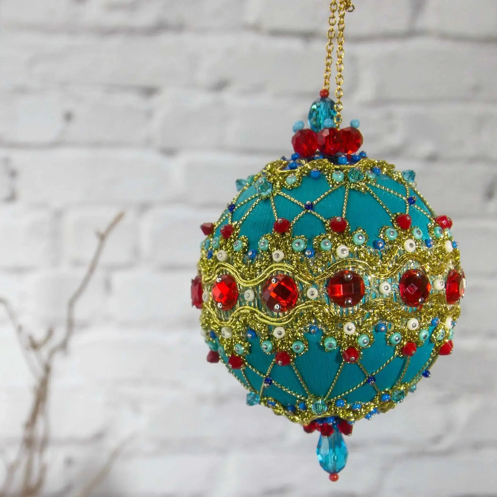 Scheherazade  Handmade Satin Ornament - Teal colored Christmas push pin decoration, featuring red rhinestones, red bicone beads, sequins, and metallic cord, perfect for holiday crafting, front view. (Light Sea Green)