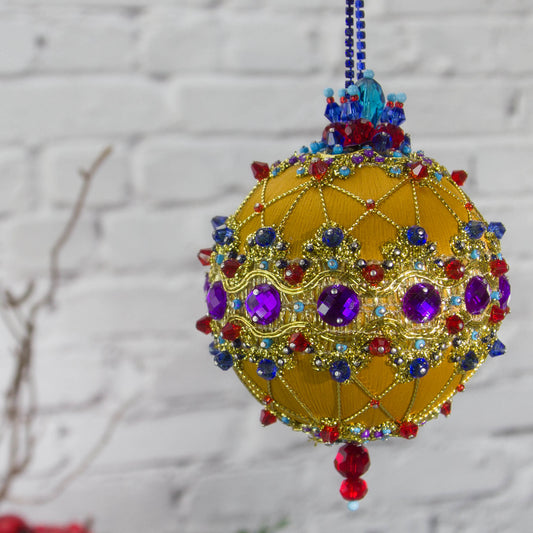 Scheherazade Handmade Satin Ornament -Festive mustard-colored ball with purple rhinestones, sparkling gold trim, sequins, indigo rhinestone chain. and metallic cord. (Gold) 
