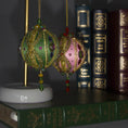 Load image into Gallery viewer, Collection of handmade Beaded Christmas Ornaments Uliger embellished with gold trim, color-shifting rhinestones, and sequins.
