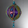 Load image into Gallery viewer, Christmas Beaded Ornament Kit Ball embellished with glass rhinestones, gold braided trim, and crystal beads. Side view. (Indigo).
