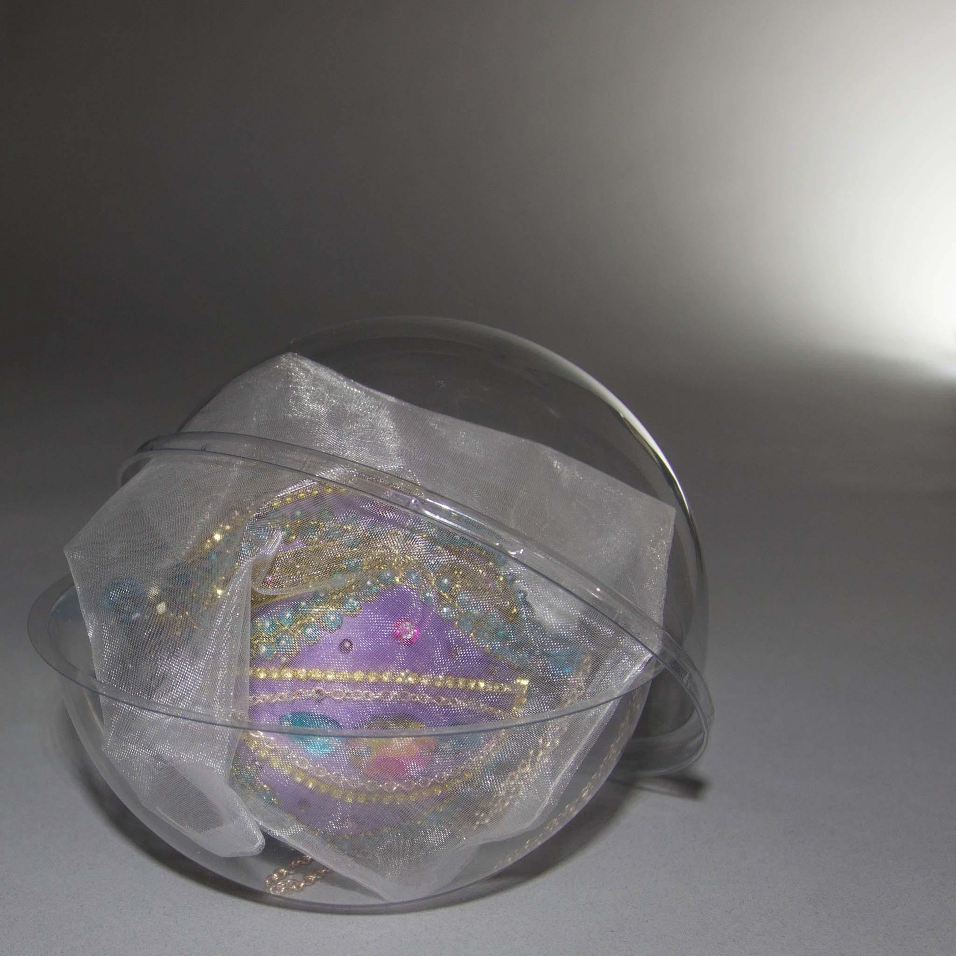 Packaging for Christmas Beaded Ornament Ball embellished with glass rhinestones, gold braided trim, and crystal beads.  (Medium Purple).