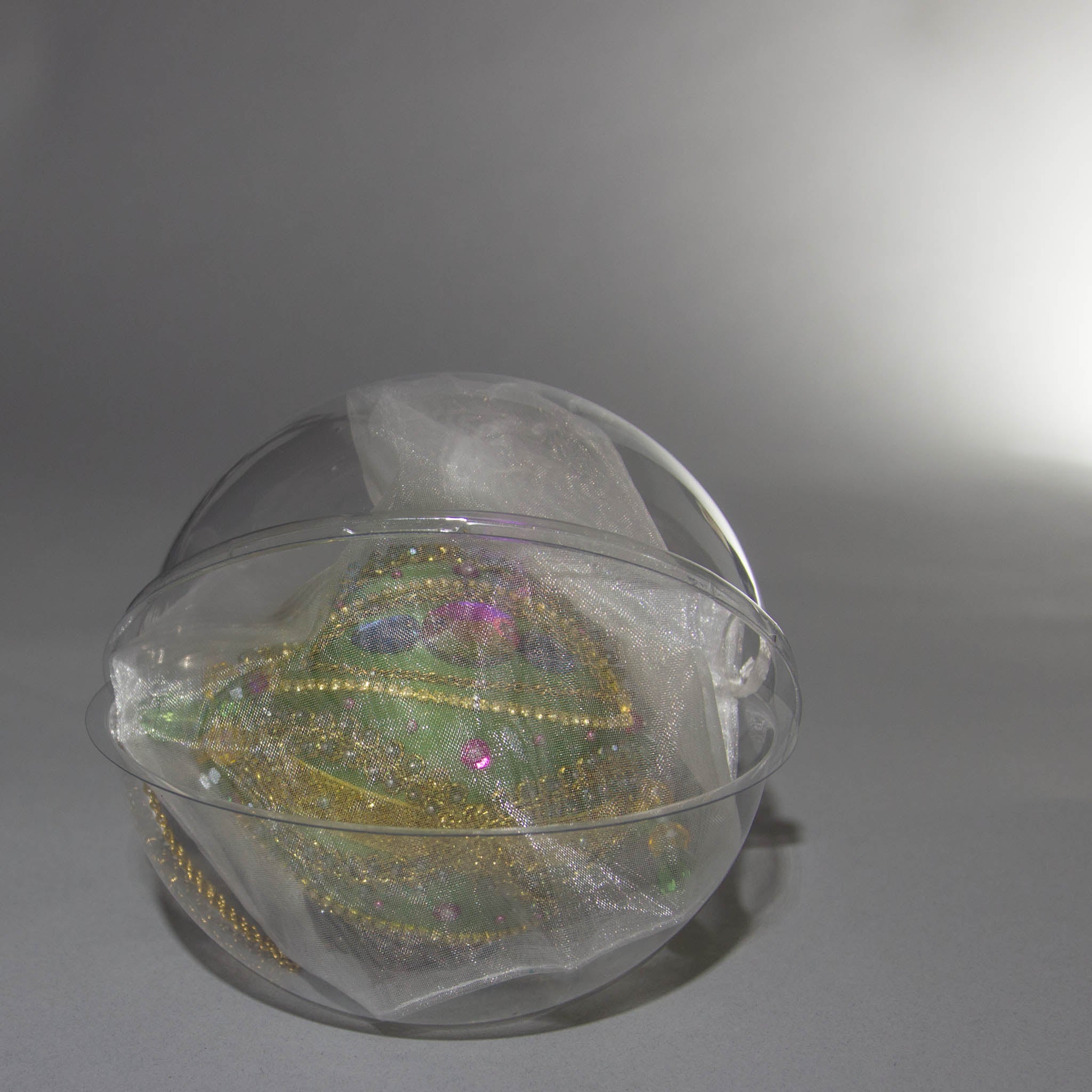 Packaging for Christmas Beaded Ornament Ball embellished with glass rhinestones, gold braided trim, and crystal beads.  (Olive).