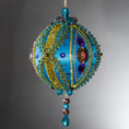 Load image into Gallery viewer, Christmas Beaded Ornament Kit Ball embellished with glass rhinestones, gold braided trim, and crystal beads. Side view. (Sky Blue).
