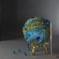Load image into Gallery viewer, Christmas Beaded Ornament Kit Ball embellished with glass rhinestones, gold braided trim, and crystal beads. Top detail. (Sky Blue).
