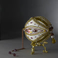 Load image into Gallery viewer, Christmas Beaded Ornament Ball embellished with glass rhinestones, gold braided trim, and crystal beads. Bottom detail. (White).
