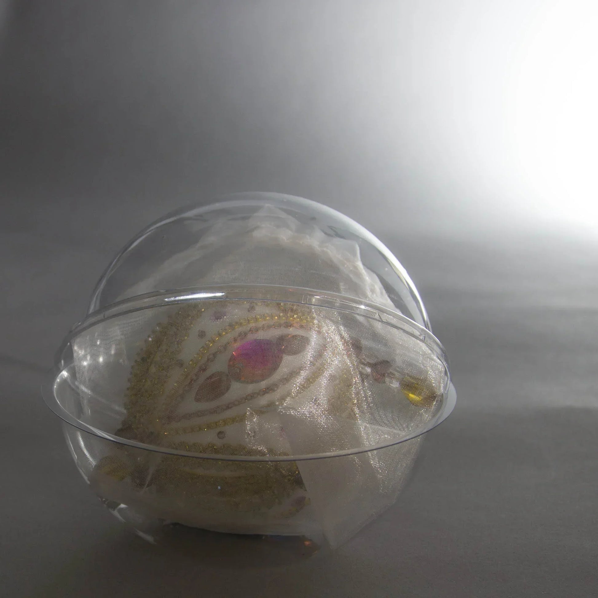 Handmade Christmas Beaded Ornament Ornament Uliger wrapped in organza and packed in a round clear container for storing. (White).