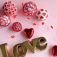 Load image into Gallery viewer, Decorative items with red hearts and gold 'LOVE' letters on a pink background
