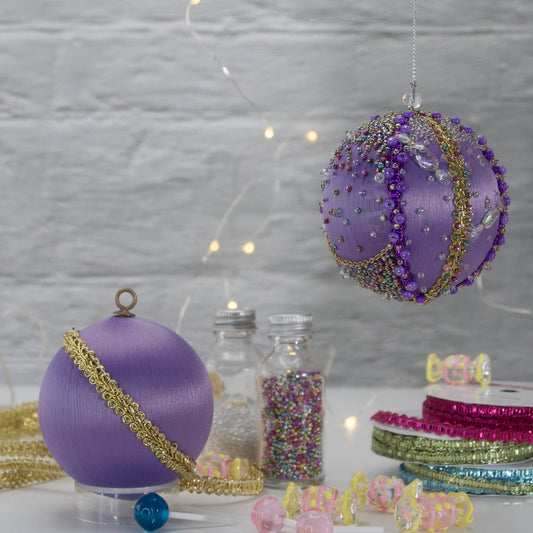 A close-up of Handmade Christmas Ornament Candy by Whim5seasons - thousand of Miyuki seed beads, meticulously applied one by one by hand. (Medium Purple) 