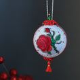 Load image into Gallery viewer, White festive decorative Christmas ornament with embroidered red rose on a dark background. (White)
