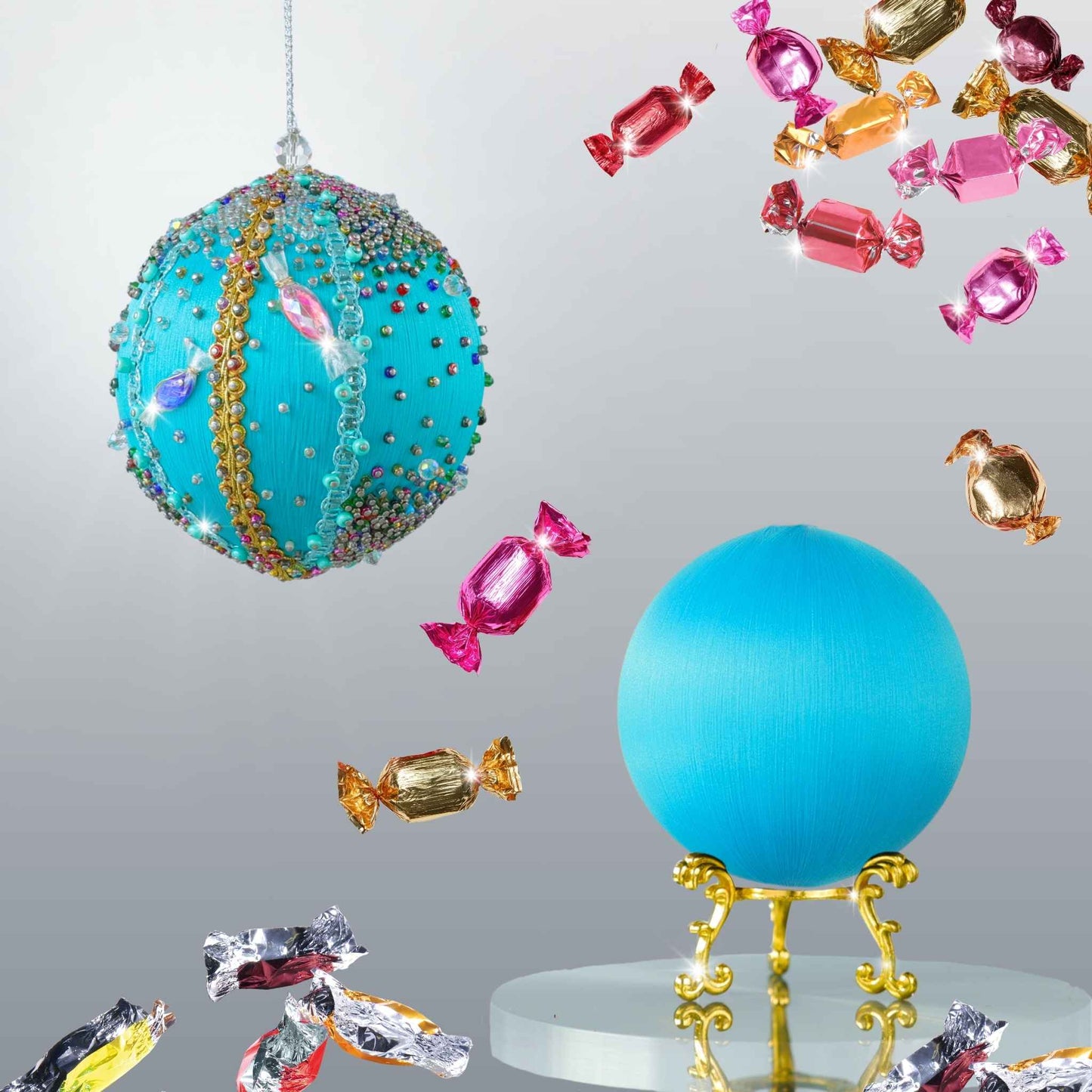 DIY pushh pin ornament kit includes a blue satin ball, and embellishments, surrounded by colorful candy objects on a light gray background by Whim5seasons.