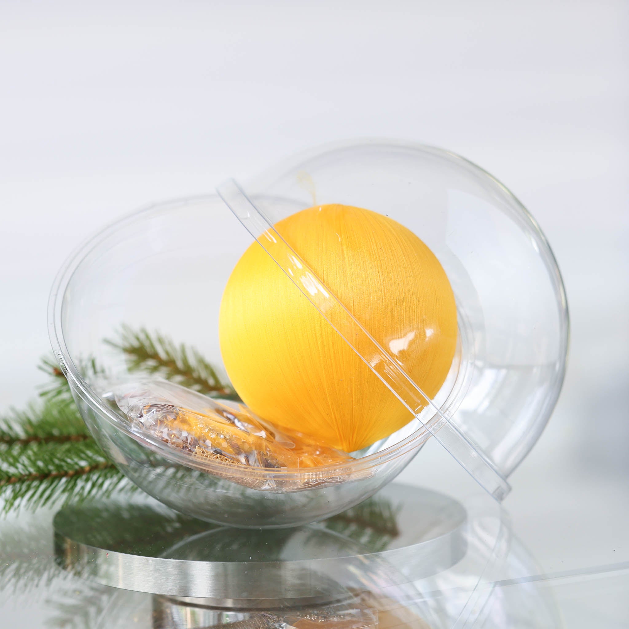 Yellow Satin Ornament Kit in a clear container with a foam ball, and push pin kit materials in a small clear bag on a reflective suface by Whim5seasons. (Light Yellow)