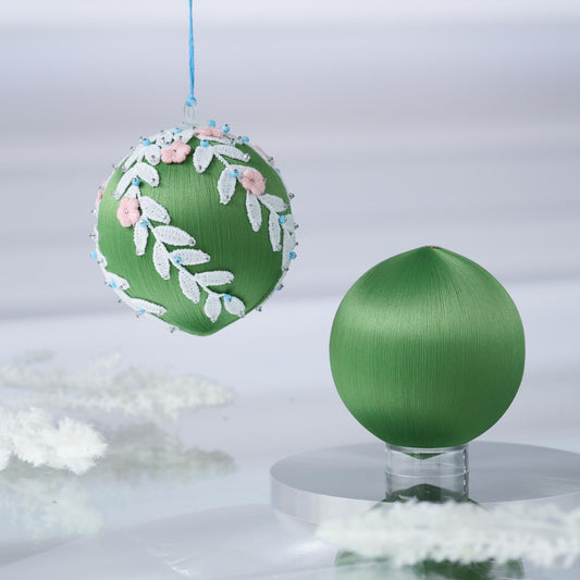 Two satin balls - one is a completed handmade push pin ornament, and the other is a green foam base to be used for a DIY Christmas craft project. (Olive)