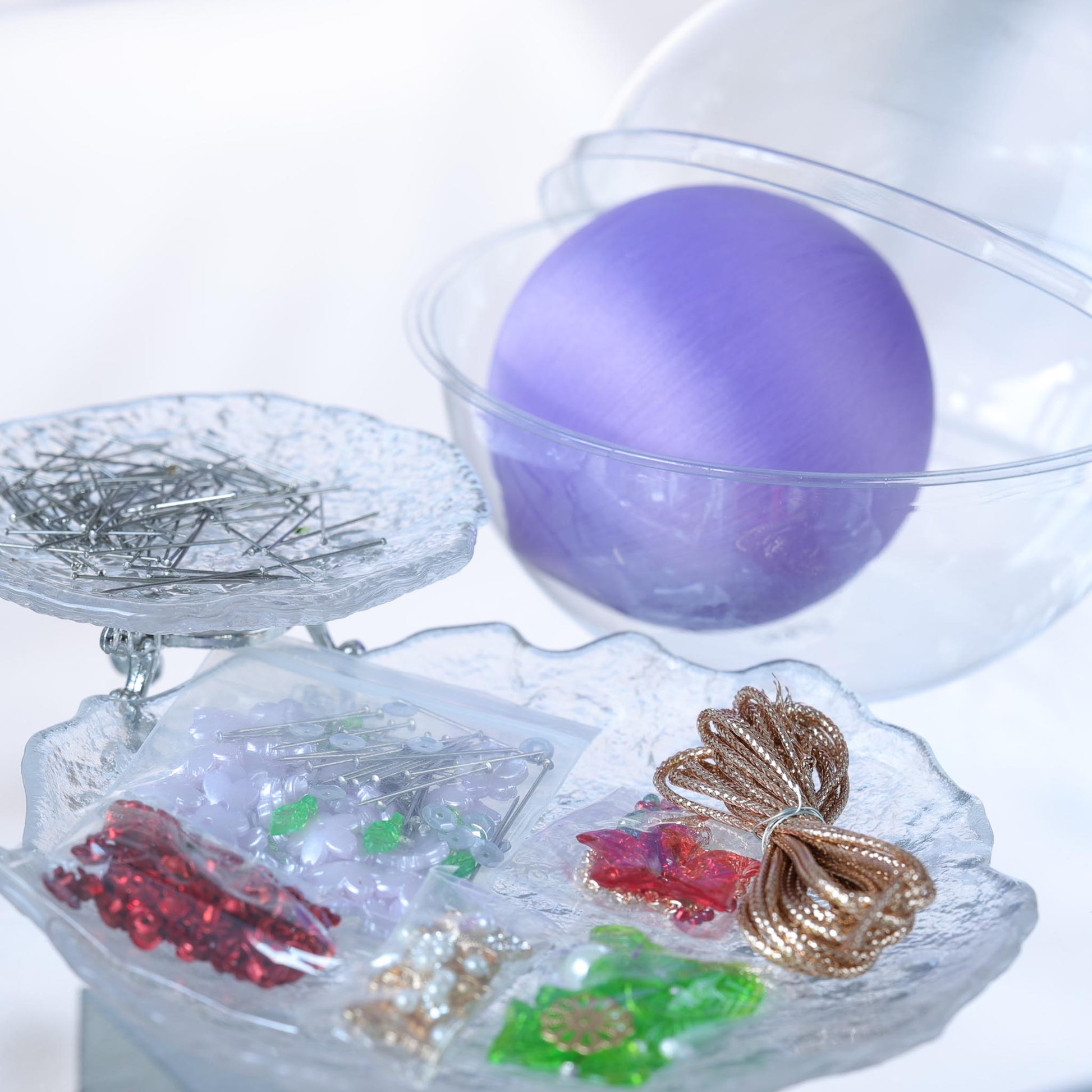 Satin Ornament Kit packed ready to go: purple ball, crafting materials, clear container against a floral background. From whim5seasons.