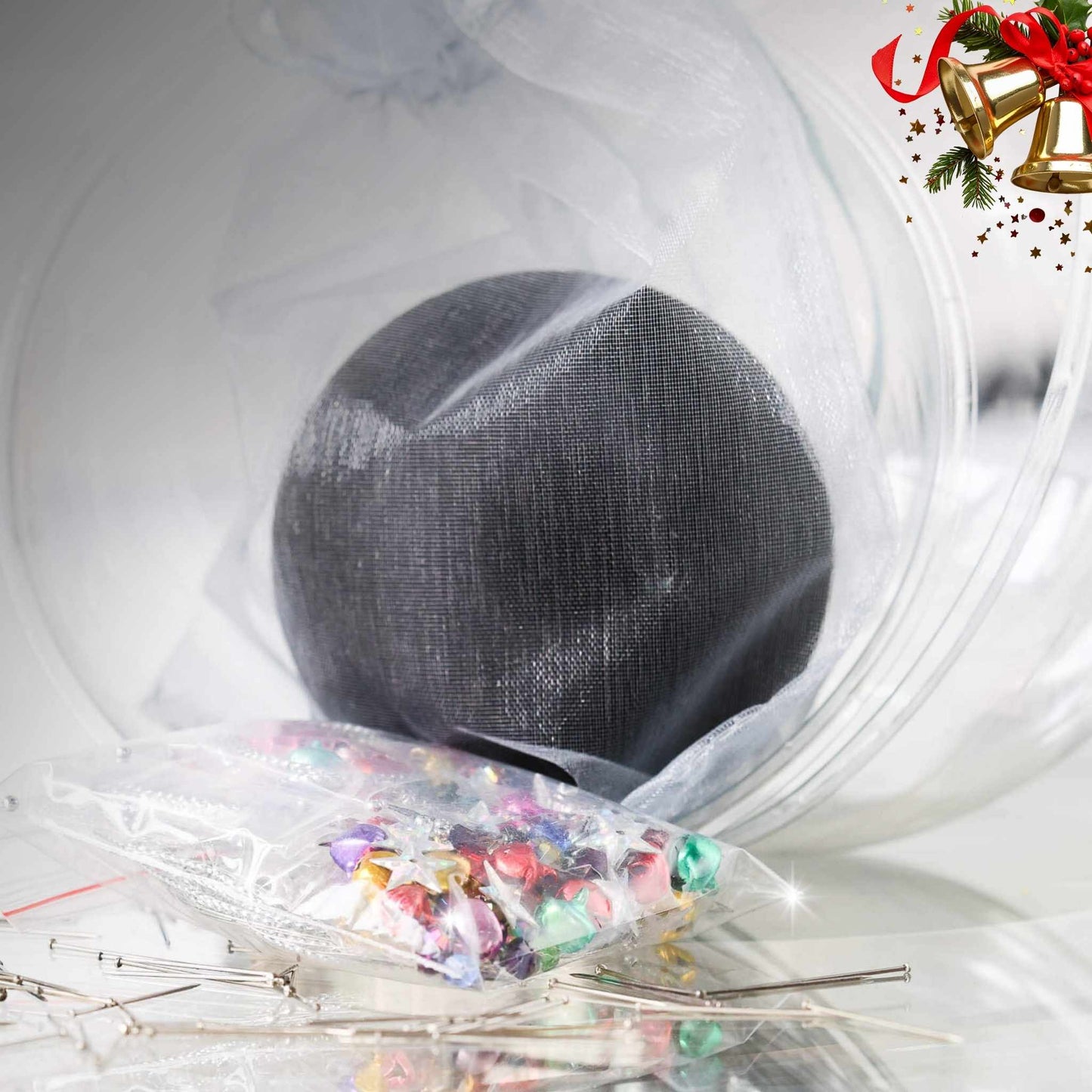 Push Pin Ornament Kit comes in a clear plastic container with  a black satin ball, tiny colorful jingle bells, and star sequins in a small clear bag, set against a white background by Whim5seasons.
