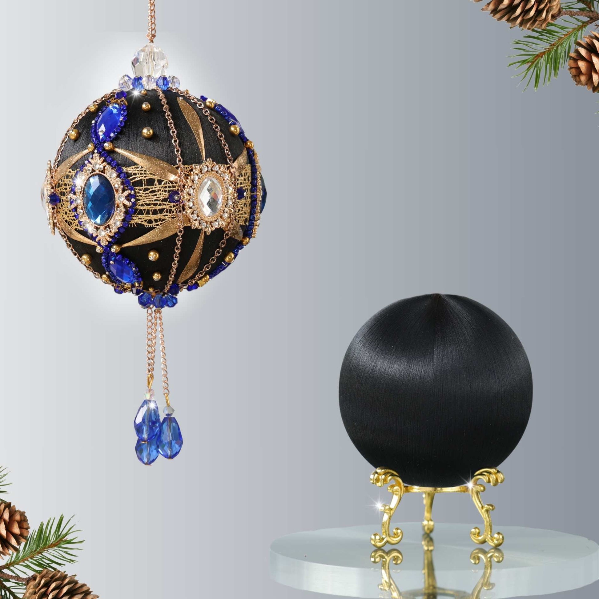 Christmas ornament kit showing two balls - one is a complete handmade black push pin ornament with blue gemstones , and the other is a satin foam ball to be decorated by Whim5seasons.