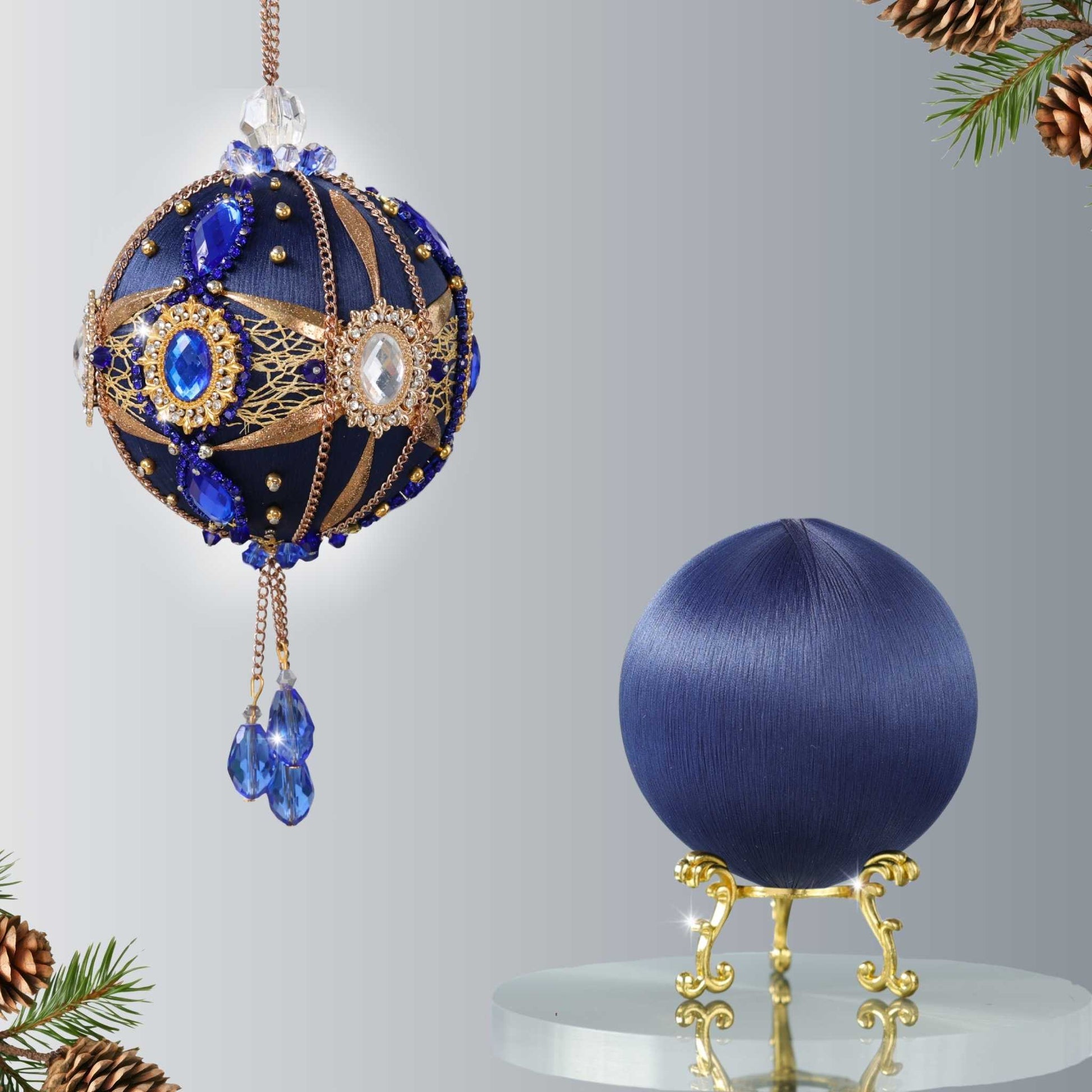 Two satin balls - one is a completed handmade satin ornament, and the other is a dark navy foam ball to be used for a DIY Christmas craft project by Whim5seasons.