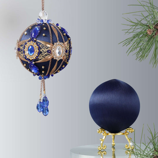 Two satin balls - one is a completed handmade satin ornament, and the other is a dark navy foam ball to be used for a DIY Christmas craft project by Whim5seasons. (Navy)