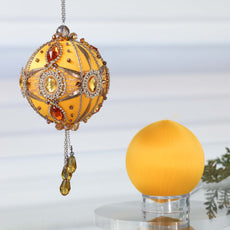 Christmas ornament kit showing two balls - one is a complete handmade yellow push pin ornament with gemstones , and the other is a satin foam ball to be decorated by Whim5seasons. (Light Yellow)