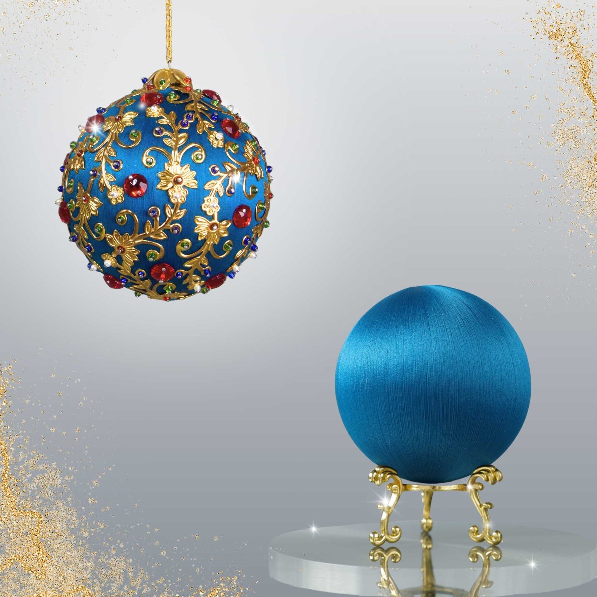 Two satin balls - one is a completed Quam Beginner-Friendly Push Pin Ornament, and the other is a navy-colored ball on a gold stand from Whim5seasons.
