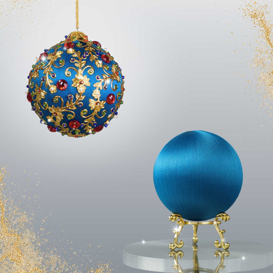 Two satin balls - one is a completed Quam Beginner-Friendly Push Pin Ornament, and the other is a navy-colored ball on a gold stand from Whim5seasons.