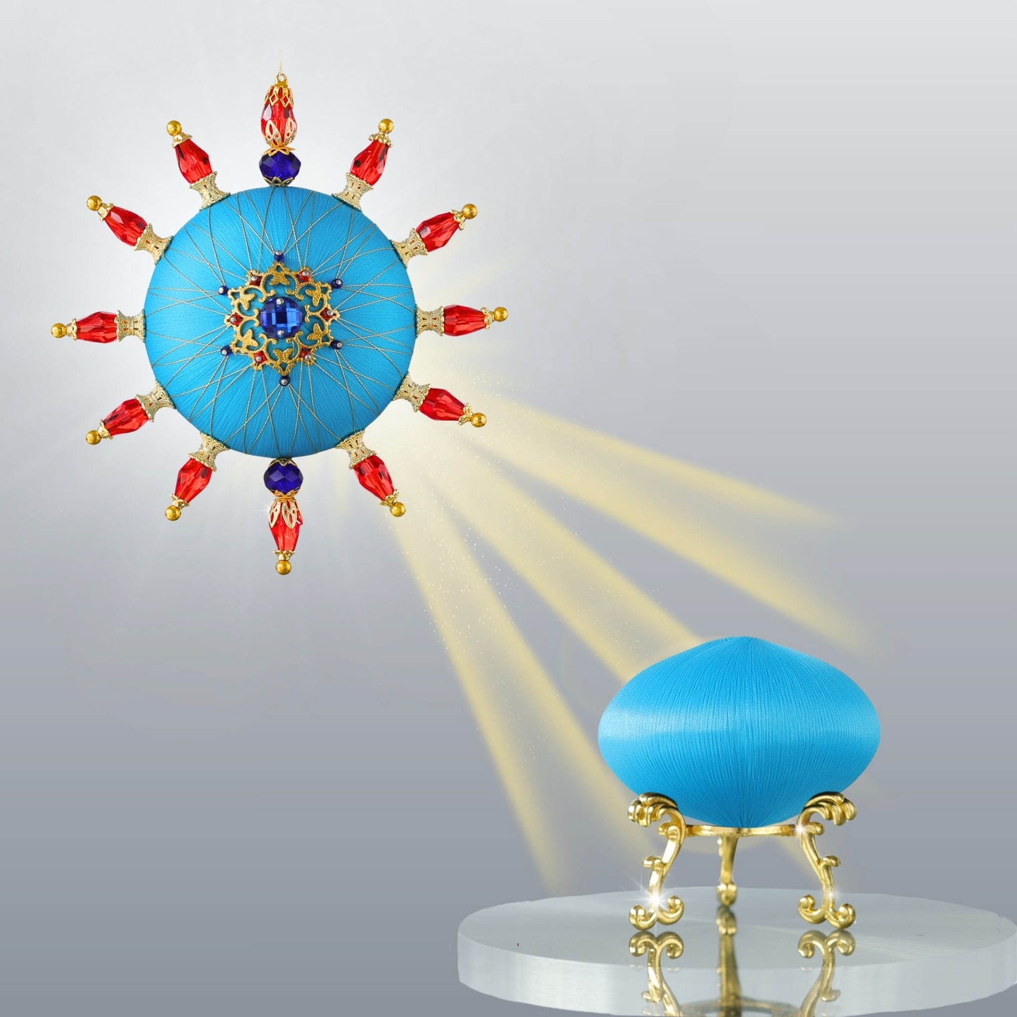Sun-shaped bright and festive blue satin push pin ornament kit featuring a finished ornament and a saturn-shaped foam base for a project by Whim5seasons.
