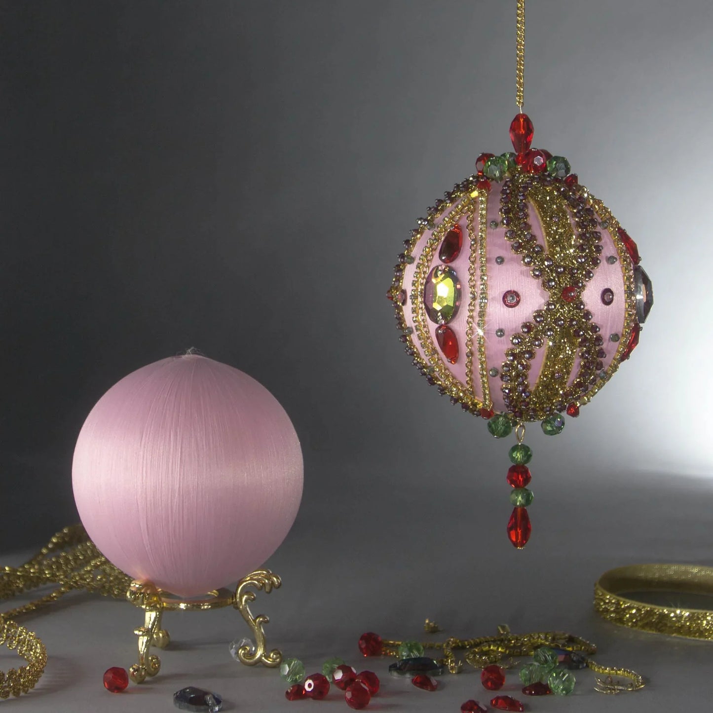 Christmas Push Pin Ornament Kit is an DIY project - showing finished end result ball embellished with glass rhinestones, gold braided trim, and crystal beads, and a bare satin ball as a start by Whim5seasons.