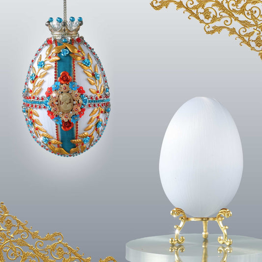 Faberge inspired Easter egg push pin ornament kit shows two egg - one is a finished ornament, and the other is a white satin foam core for a project by Whim5seasons.