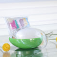 Load image into Gallery viewer, Green and clear egg-shaped storage box with an Easter Push Pin Ornament kit inside featuring large 4" satin egg and packets with seed beads by Whim5seasons. (Old Lace)
