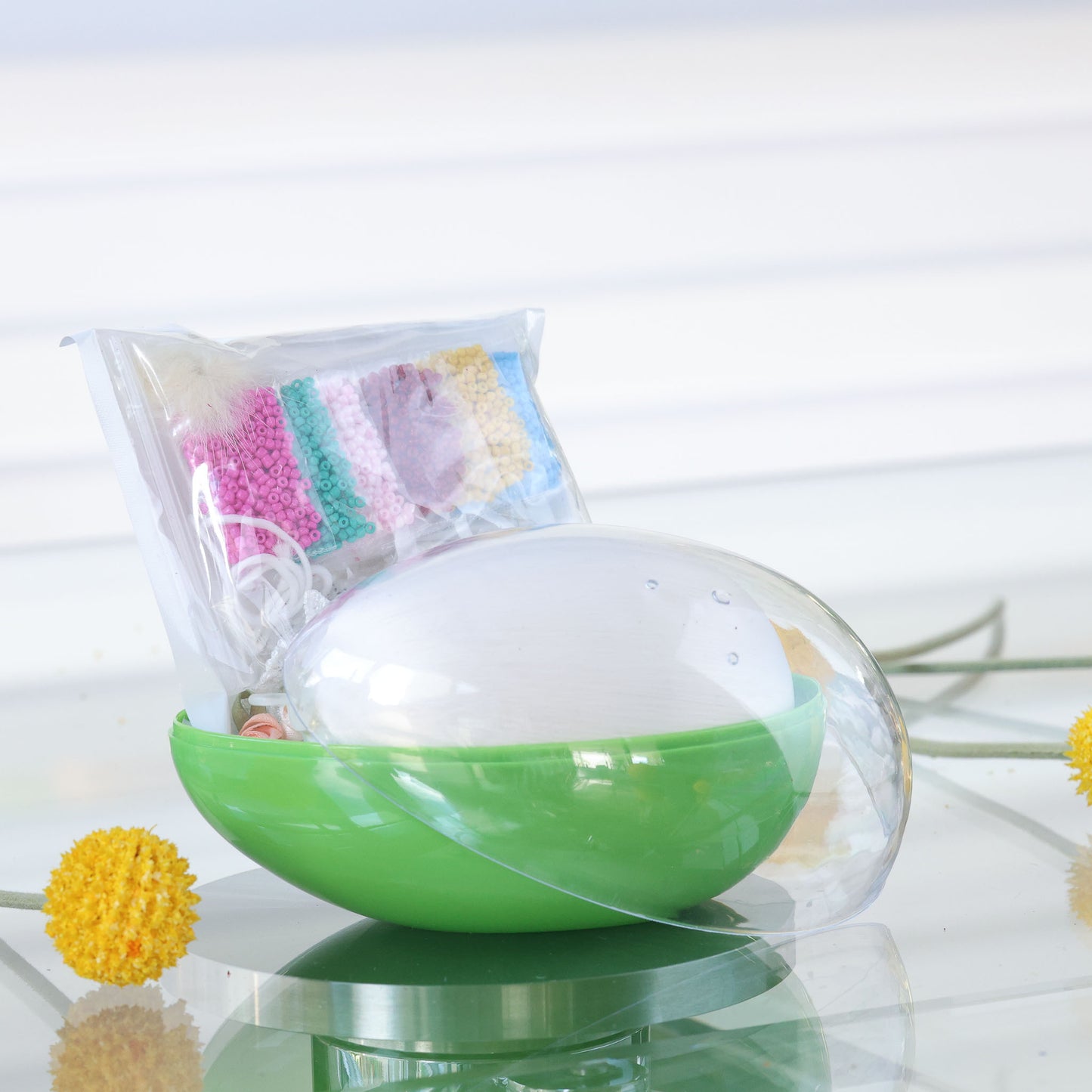 Green and clear egg-shaped storage box with an Easter Push Pin Ornament kit inside featuring large 4" satin egg and packets with seed beads by Whim5seasons.