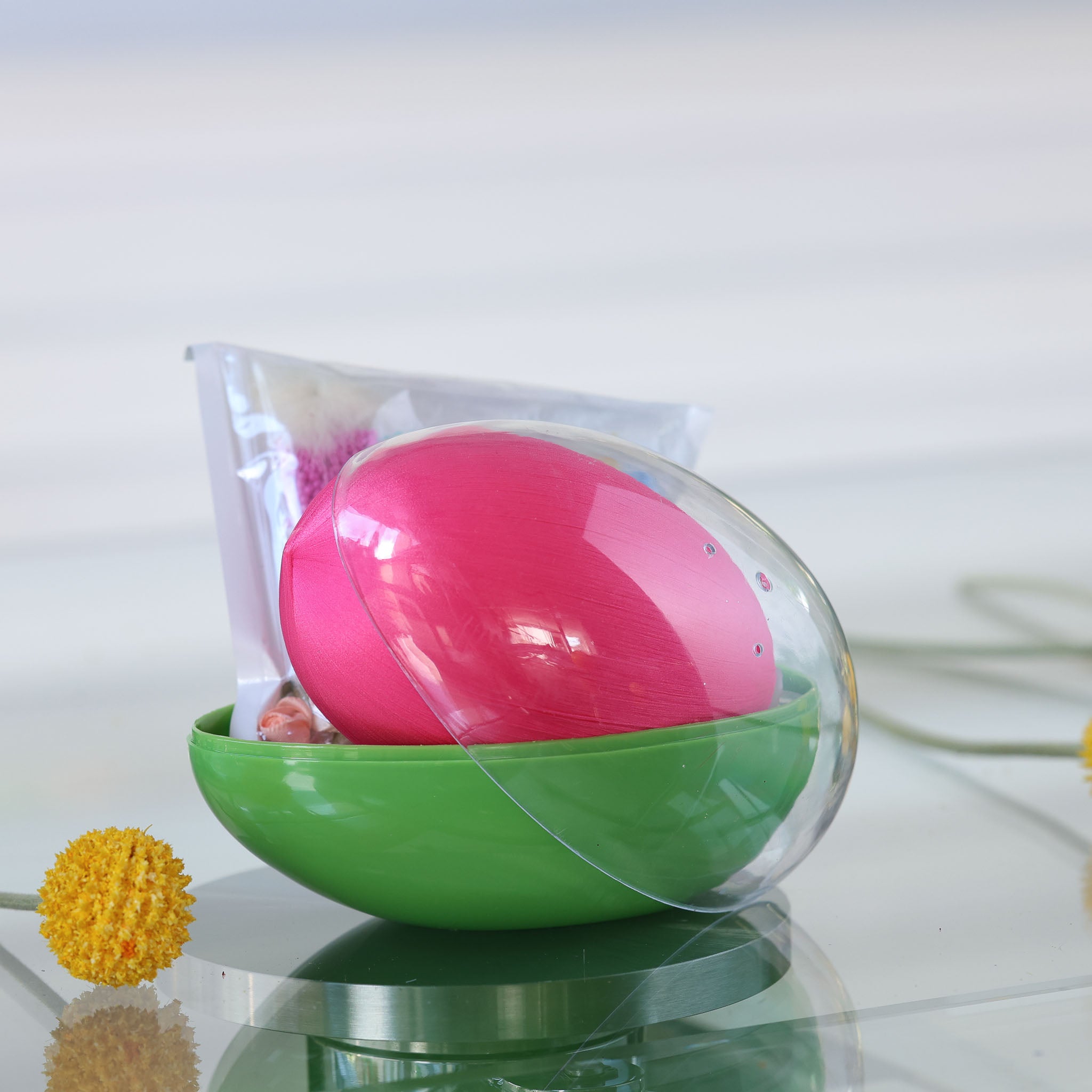 Green and clear egg-shaped storage box with an Easter Push Pin Ornament kit inside featuring large 4" pink egg and a yellow flower by Whim5seasons. (Old Lace)