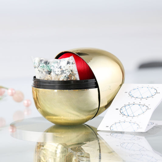 Easter Ornament Push Pin Kit Sonata comes in a gold storage container with premium red satin core and a bag of materials including black seed beads, pearls, and red beads.  (Dark Red)