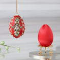 Load image into Gallery viewer, Easter Egg Push Pin Ornament  Kit features a luxurious red satin  egg shaped core, aluminum teal rose embellishments, gold beads, and metallic trim.  (Dark Red)
