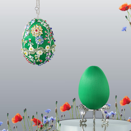 Green Easter egg push pin ornament kit  with floral patterns and colorful beads hanging on a chain against a neutral background by Whim5seasons.